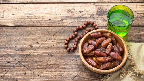 Senior Muslim woman preparing food
