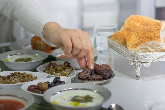 ramadan food and praying woman