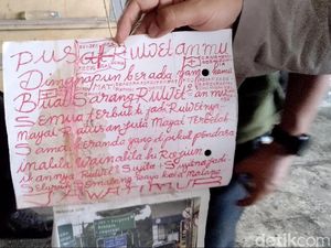 Kertas dengan Tulisan Warna Merah Ditemukan di Lokasi Mayat Mutilasi