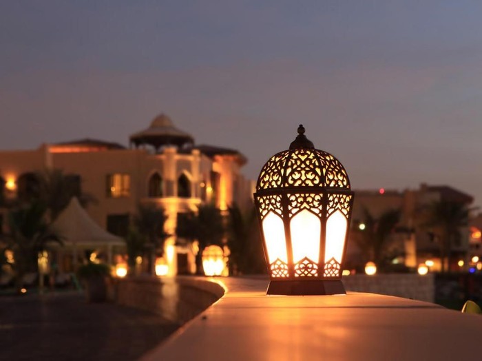 An arabesque lantern lamp Symbol of Ramadan times, also a famous Middle eastern (specially in morocco and Egypt) lighting decoration item..Some copy space was left up to fit greeting or title textMore Similar and Arabia Related..