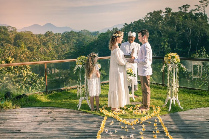 Happy newlyweds couple in marriage, wedding ceremony in Ubud. Wedding proposal