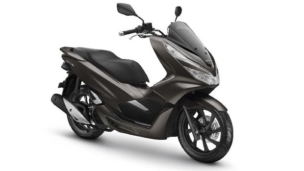 Honda PCX dilaburi warna Magnificient Matte Brown.