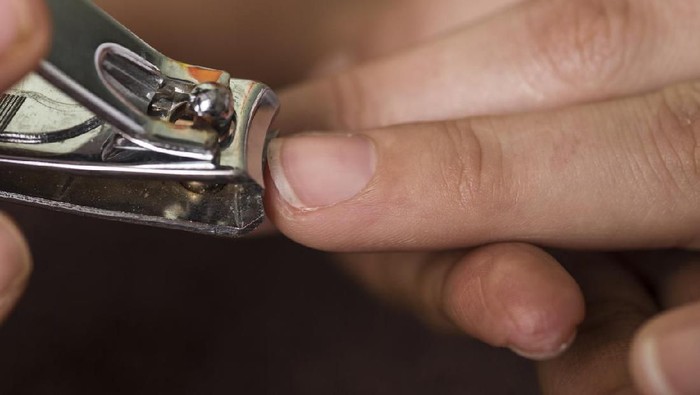 A closeup image of hands during a manicure