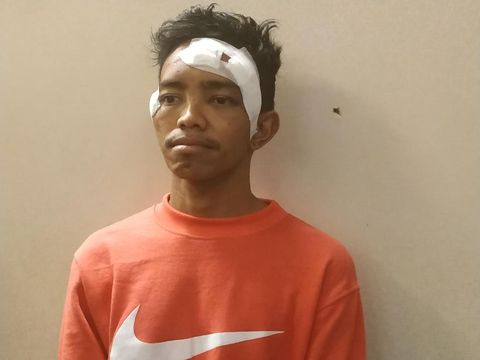 A alias Andri Bibir (30) yang dipukuli Brimob beberapa personel Brimob di dekat Masjid Al-Huda, Kampung Bali