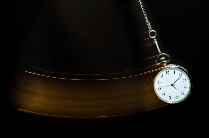 A pocket watch swinging.