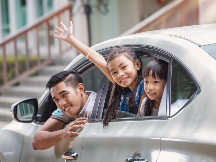 Father and daughter on car and smile from car windows before start family travel trip in holiday, this immage can use for family , travel, car, weekend, and summer concept