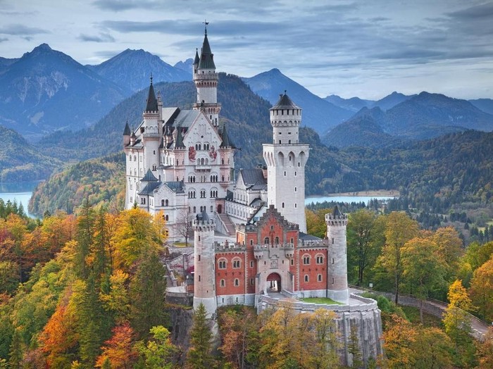 Hohenschwangau, Germany - August 10, 2015: view of Neuschwanstein Castle on august 10th near Hohenschwangau, Germany during foggy summer twilight.