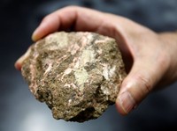FILE PHOTO: A bastnaesite mineral containing rare earth is pictured at a laboratory of Yasuhiro Kato, an associate professor of earth science at the University of Tokyo, July 5, 2011. REUTERS/Yuriko Nakao/File Photo