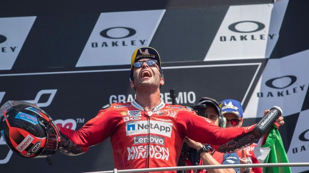 SCARPERIA, ITALY - JUNE 02: Danilo Petrucci of Italy and Ducati Team  celebrates his first victory on the podium at the end of the MotoGP race during the MotoGp of Italy - Race at Mugello Circuit on June 02, 2019 in Scarperia, Italy. (Photo by Mirco Lazzari gp/Getty Images)
