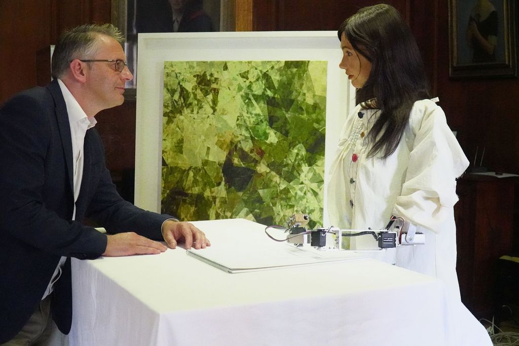 British gallery owner Aidan Meller looks at paintings created using computer vision data recorded by robot artist 'Ai-Da', the paintings form part of Ai-Da’s debut 