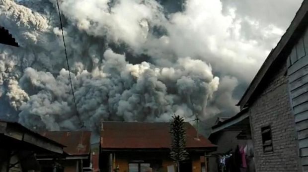 A volcanic ash cloud from Mount Sinabung hovers over Karo, North Sumatra, Indonesia June 9, 2019, in this still image taken from a social media video. Sinarisa Sitepu via REUTERS ATTENTION EDITORS - THIS IMAGE HAS BEEN SUPPLIED BY A THIRD PARTY. MANDATORY CREDIT. NO RESALES. NO ARCHIVES     TPX IMAGES OF THE DAY