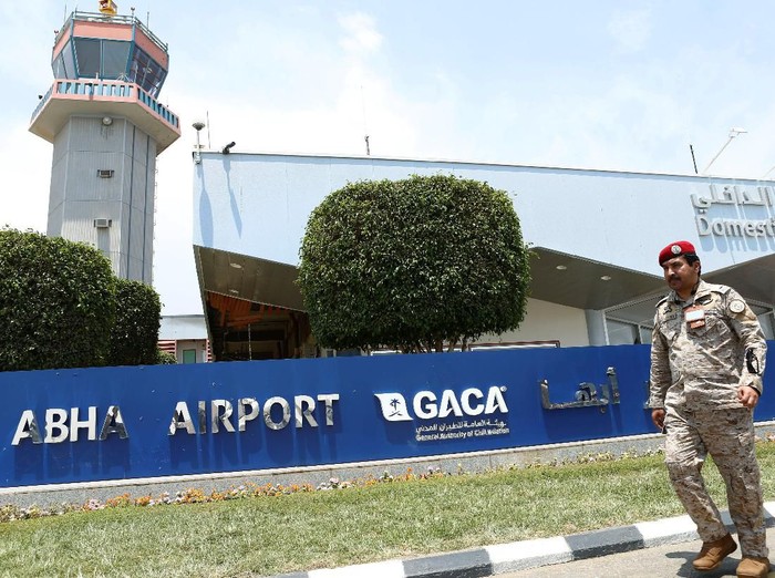 A Saudi security officer walks past the Saudi Arabias Abha airport, after it was attacked by Yemens Houthi group in Abha, Saudi Arabia June 13, 2019. REUTERS/Faisal al Nasser