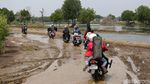 Potret Perjuangan Warga Muara Gembong Lintasi Jalan Rusak
