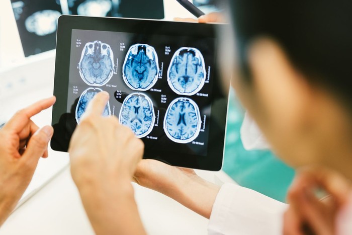 Doctor and patient using digital tablet