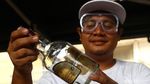 Kreatif! Botol Bekas Disulap Jadi Tempat Lampu dan Lilin