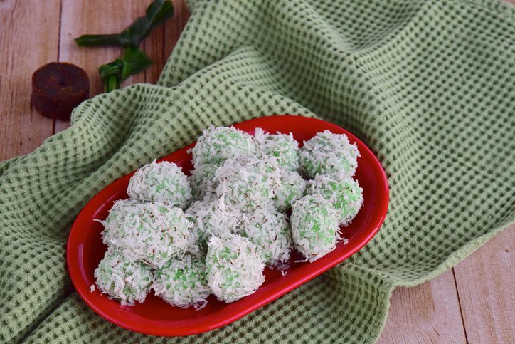 Indonesian Cuisine, Klepon or Traditional Pandanus Rice Balls Made From Glutinous Flour and Grated Coconut with Palm sugar Filling.