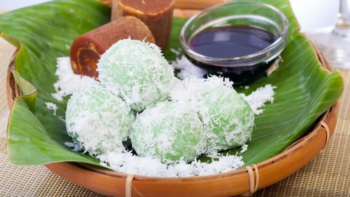 Indonesian Cuisine, Klepon or Traditional Pandanus Rice Balls Made From Glutinous Flour and Grated Coconut with Palm sugar Filling.
