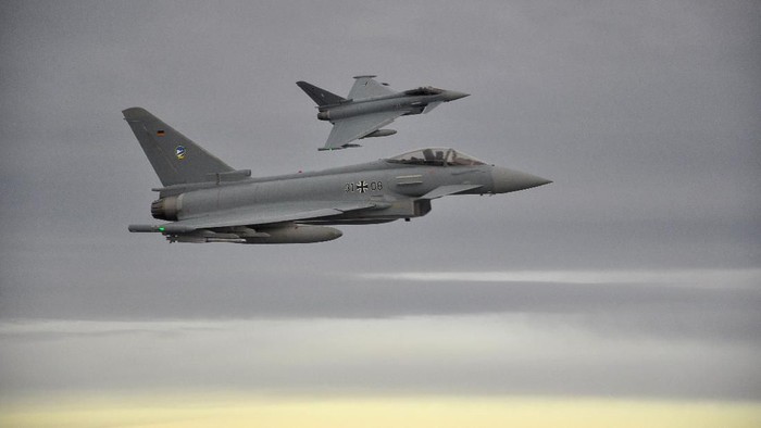 FILE PHOTO: Two German Eurofighter jets simulate the interception of a plane over the Baltic sea November 1, 2018. REUTERS/Sabine Siebold/File Photo