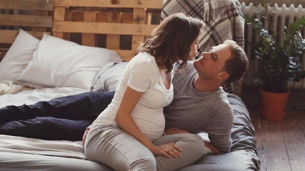 Beautiful pregnant woman and her husband