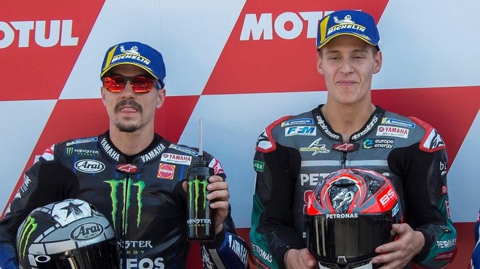 ASSEN, NETHERLANDS - JUNE 29: (L-R)  Maverick Vinales of Spain and Yamaha Factory Racing, Fabio Quartararo of France and Petronas Yamaha SRT and Alex Rins of Spain and Team Suzuki ECSTAR celebrate at the end of the qualifying practice during the MotoGP Netherlands - Qualifying on June 29, 2019 in Assen, Netherlands. (Photo by Mirco Lazzari gp/Getty Images)