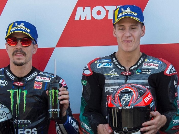 ASSEN, NETHERLANDS - JUNE 29: (L-R)  Maverick Vinales of Spain and Yamaha Factory Racing, Fabio Quartararo of France and Petronas Yamaha SRT and Alex Rins of Spain and Team Suzuki ECSTAR celebrate at the end of the qualifying practice during the MotoGP Netherlands - Qualifying on June 29, 2019 in Assen, Netherlands. (Photo by Mirco Lazzari gp/Getty Images)