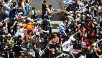 Dalam festival air tersebut warga akan berkumpul di kawasan Seoul dengan membawa serta pistol air untuk memeriahkan festival yang digelar dalam rangka menyambut musim panas. Chung Sung-Jun/Getty Images.