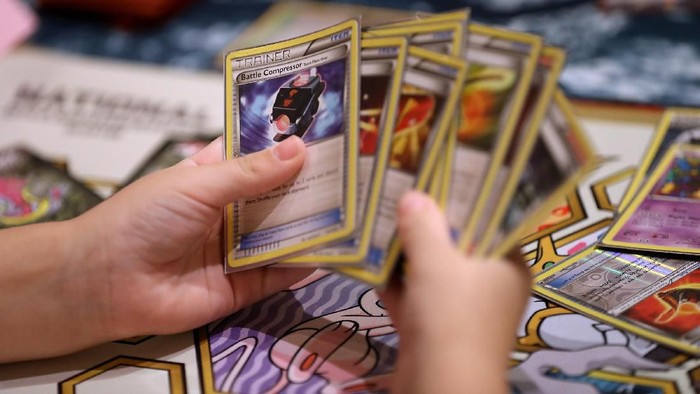 SAN FRANCISCO, CA - AUGUST 19:  A contestant looks at cards as he competes during the 2016 Pokemon World Championships on August 19, 2016 in San Francisco, California. Over 1,600 contestants from more than 30 countries are competing in tournaments of the Pokemon video game, Pokken and Trading Card Game events during the 2016 Pokemon World Championships. $500,000 in scholarships and prizes will be awarded to winners.  (Photo by Justin Sullivan/Getty Images)