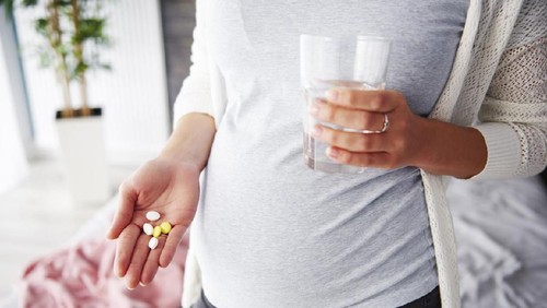 Pregnant woman taking medicines
