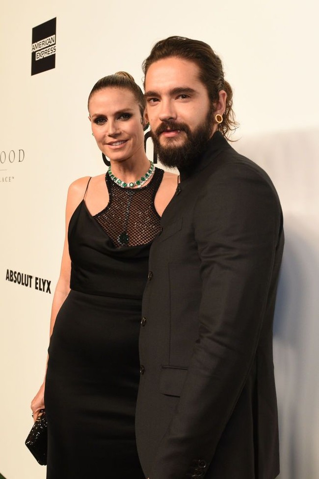 Heidi Klum dan Tom Kaulitz pertamakali dikabarkan pacaran pada Maret 2018. Saat itu Heidi dan pria berusia 29 tahun itu terlihat berciuman di lokasi syuting Americas Got Talent. Pada acara itu, Heidi diketahui menjadi salah satu juri. Foto: Getty Images
