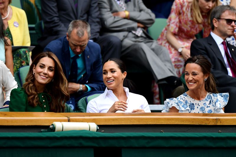 LONDON, ENGLAND - JULY 13: (L-R) Catherine, Duchess of Cambridge, Meghan, Duchess of Sussex and Pippa Middleton look on from the Royal Box as Serena Williams of The United States is interviewed after the Ladies' Singles final during Day twelve of The Championships - Wimbledon 2019 at All England Lawn Tennis and Croquet Club on July 13, 2019 in London, England. (Photo by Laurence Griffiths/Getty Images)