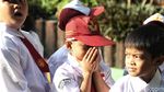 Lucu! Beragam Ekspresi Siswa SD di Hari Pertama Sekolah