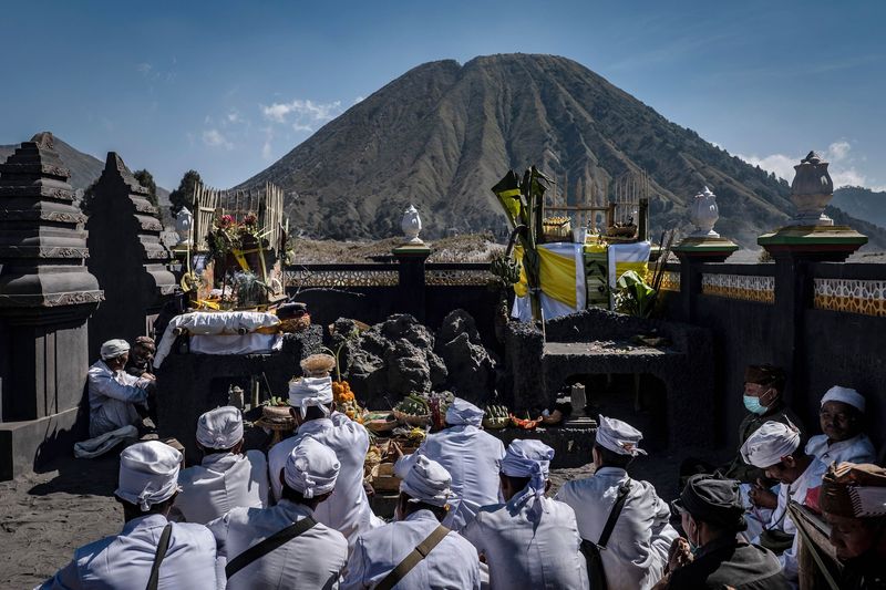 PROBOLINGGO, EAST JAVA, INDONESIA - JULY 16: Frost is seen covering the area of Mount Bromo on July 16, 2019 in Probolinggo, East Java, Indonesia. Tenggerese people are a Javanese ethnic group in eastern Java who claim to be the descendants of the Majapahit princes. Their population of roughly 500,000 is centered in the Bromo Tengger Semeru National Park in eastern Java. The most popular ceremony is the Kasada festival, the most visited tourist attraction in Indonesia. The festival is the main festival of the Tenggerese people and lasts about a month. On the fourteenth day, the Tenggerese make the journey to Mount Bromo to make offerings of rice, fruits, vegetables, flowers and livestock to the mountain gods by throwing them into the volcano's caldera. The origin of the festival lies in the 15th century when a princess named Roro Anteng started the principality of Tengger with her husband Joko Seger, and the childless couple asked the mountain Gods for help in bearing children. The legend says the Gods granted them 24 children but on the provision that the 25th must be tossed into the volcano in sacrifice. The 25th child, Kesuma, was finally sacrificed in this way after initial refusal, and the tradition of throwing sacrifices into the caldera to appease the mountain Gods continues today. (Photo by Ulet Ifansasti/Getty Images)