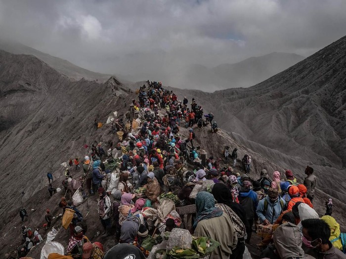 PROBOLINGGO, EAST JAVA, INDONESIA - JULY 18: Goats, caught by villagers, are tethered after being thrown as offerings by Tenggerese worshippers at the foot of Mount Bromo during the Yadnya Kasada Festival at crater of Mount Bromo on July 18, 2019 in Probolinggo, East Java, Indonesia. Tenggerese people are a Javanese ethnic group in Eastern Java who claimed to be the descendants of the Majapahit princes. Their population of roughly 500,000 is centered in the Bromo Tengger Semeru National Park in eastern Java. The most popular ceremony is the Kasada festival, which makes it the most visited tourist attraction in Indonesia. The festival is the main festival of the Tenggerese people and lasts about a month. On the fourteenth day, the Tenggerese made a journey to Mount Bromo to make offerings of rice, fruits, vegetables, flowers and livestock to throw them into the volcanos caldera. The origin of the festival lies in the 15th century princess named Roro, the principality of Tengger with her husband Joko Seger, and the childless couple asked mountain Gods for help in bearing children. The legend says the Gods granted them 24 children but on the provision that the 25th must be added to the volcano in sacrifice. The 25th child, Kesuma, was finally sacrificed in this initial after refusal, and the tradition of throwing sacrifices into the Caldera to appease the mountain Gods continues today. (Photo by Ulet Ifansasti / Getty Images)