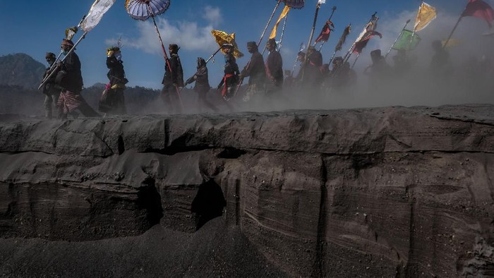 PROBOLINGGO, EAST JAVA, INDONESIA - JULY 16: Frost is seen covering the area of Mount Bromo on July 16, 2019 in Probolinggo, East Java, Indonesia. Tenggerese people are a Javanese ethnic group in eastern Java who claim to be the descendants of the Majapahit princes. Their population of roughly 500,000 is centered in the Bromo Tengger Semeru National Park in eastern Java. The most popular ceremony is the Kasada festival, the most visited tourist attraction in Indonesia. The festival is the main festival of the Tenggerese people and lasts about a month. On the fourteenth day, the Tenggerese make the journey to Mount Bromo to make offerings of rice, fruits, vegetables, flowers and livestock to the mountain gods by throwing them into the volcanos caldera. The origin of the festival lies in the 15th century when a princess named Roro Anteng started the principality of Tengger with her husband Joko Seger, and the childless couple asked the mountain Gods for help in bearing children. The legend says the Gods granted them 24 children but on the provision that the 25th must be tossed into the volcano in sacrifice. The 25th child, Kesuma, was finally sacrificed in this way after initial refusal, and the tradition of throwing sacrifices into the caldera to appease the mountain Gods continues today. (Photo by Ulet Ifansasti/Getty Images)