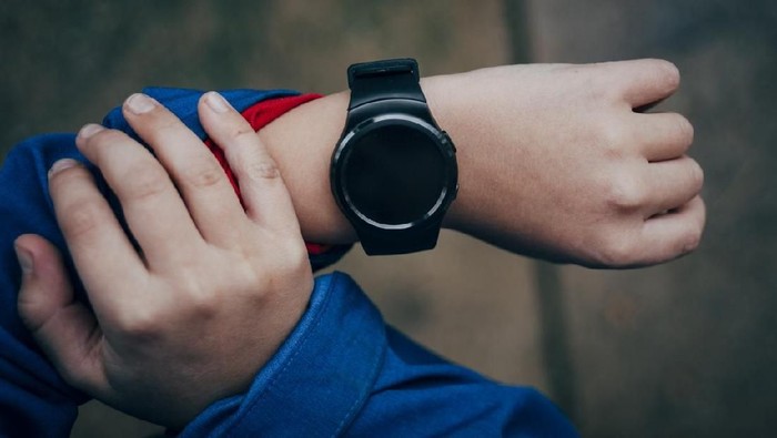 Smart watch on the boys hand-from above