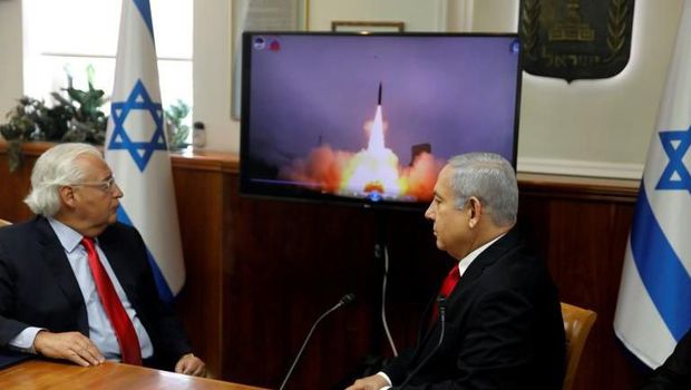 Israeli Prime Minister Benjamin Netanyahu (R) and US Ambassador to Israel David Friedman watch a video which shows the launch of the Arrow-3 hypersonic anti-ballistic missile during a cabinet meeting in Jerusalem on July 28 2019 (AFP Photo/MENAHEM KAHANA)