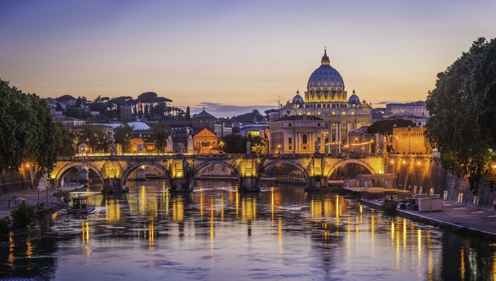 Iconic landmarks of Rome, Italys ancient capital city, reflecting in the tranquil waters of the River Tiber. ProPhoto RGB profile for maximum color fidelity and gamut.