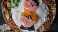 Pasti tahu dong tokoh kartun apa yang dibuat lewat dua buah telur ceplok ini? Ya, Giant di film Doraemon! Foto: Instagram etn.co_mam