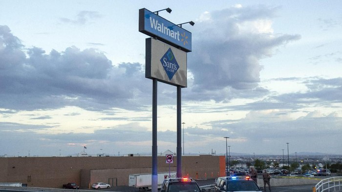 Texas state police cars block the access to the Walmart store in the aftermath of a mass shooting in El Paso, Texas, Saturday, Aug. 3, 2019. Multiple people were killed and one person was in custody after a shooter went on a rampage at a shopping mall, police in the Texas border town of El Paso said. (AP Photo/Andres Leighton)