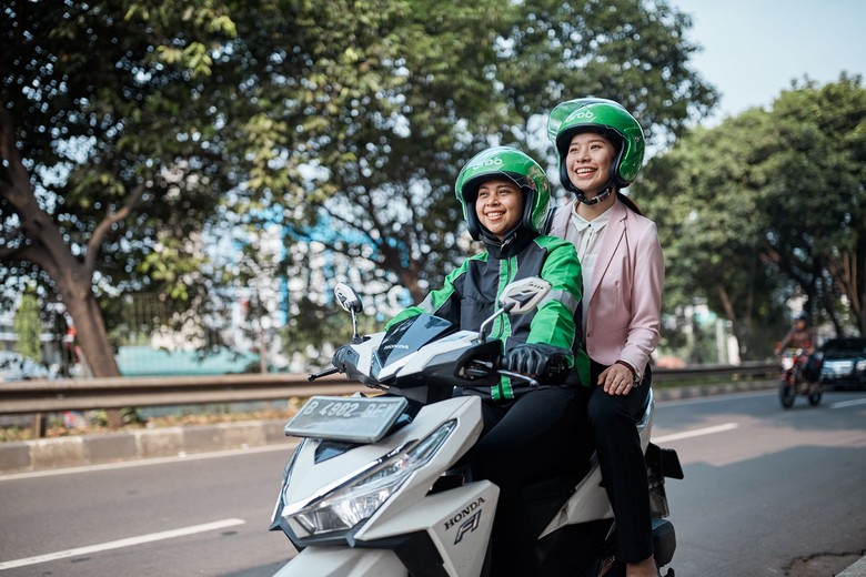 Ilustrasi driver ojol wanita. Foto: Grab Indonesia Ilustrasi driver ojol wanita. Foto: Grab Indonesia