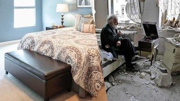 Mohammed Mohiedin Anis, 70, merokok di pipanya ketika dia duduk di kamarnya di Aleppo. Foto: Uğur Gallenkuş