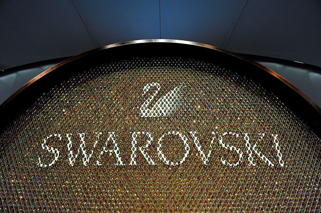 BASEL, SWITZERLAND - MARCH 16:  A Swarovski logo is displayed during Baselworld on March 16, 2016 in Basel, Switzerland. Held annually, Baselworld is the most important watch and jewellery industry showcase event for the sector.  (Photo by Harold Cunningham/Getty Images)