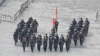 China beralasan keberadaan kendaraan militer dan tentara di kawasan itu untuk latihan.