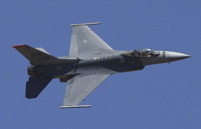 FILE - In this Feb. 24, 2019, file photo, U.S. fighter aircraft F-16 perform aerobatic maneuvers on the last day of Aero India 2019 at Yelahanka air base in Bangalore, India. The Trump administration has informed Congress it plans to sell F-16 fighters worth $8 billion to Taiwan in a move that will inflame already high tensions with China. (AP Photo/Aijaz Rahi, File)