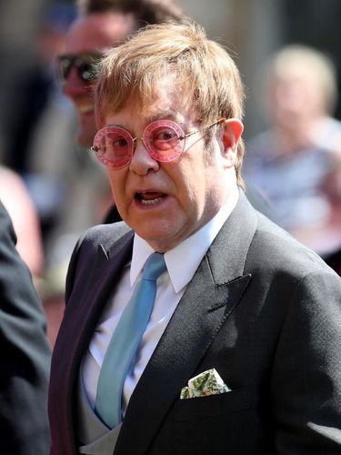 LONDON, ENGLAND - JULY 14: Prince Harry, Duke of Sussex and Meghan, Duchess of Sussex chat with British singer-songwriter Elton John at the European Premiere of Disney's 