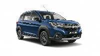Dari segi eksterior, XL6 hadir dengan tampang yang lebih maskulin. Mobil ini hadir dengan desain bumper baru, dilengkapi skid plate. Model grille-nya juga besar, dan dipertegas list chrome yang memanjang. Foto: Dok. Suzuki