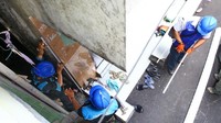 Petugas membungkus jaringan kabel menggunalan pipa demi keamanan pelanggan PLN. Istimewa/PLN.