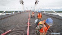 Ini adalah bagian penting dari proyek jalan raya sepanjang 19,9 km yang dimulai dari jalan bebas hambatan Jilin-Heilongjiang dan berakhir di jalan raya di Blagoveshchensk. Xinhua/Wang Jianwei.