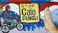 Ini dia penampakan mural yang mejeng di dinding sisi Polres Metro Bekasi Kota, Senin (26/8/2019).