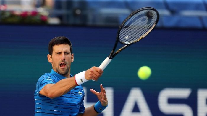 Novak Djokovic melaju ke babak kedua AS Terbuka 2019. (Foto: Elsa/Getty Images)